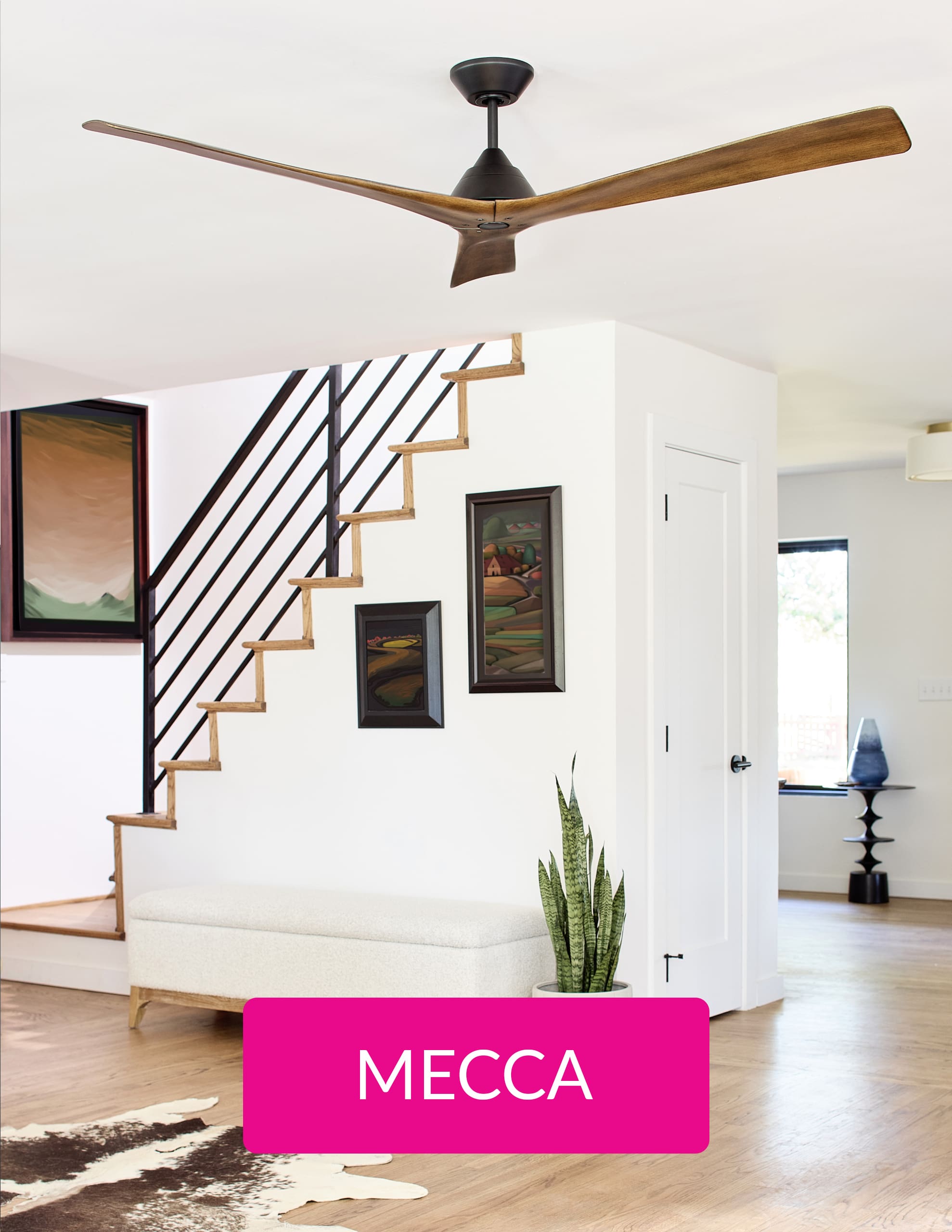 A room with stair, a brown fan and pink button with the words MECCA