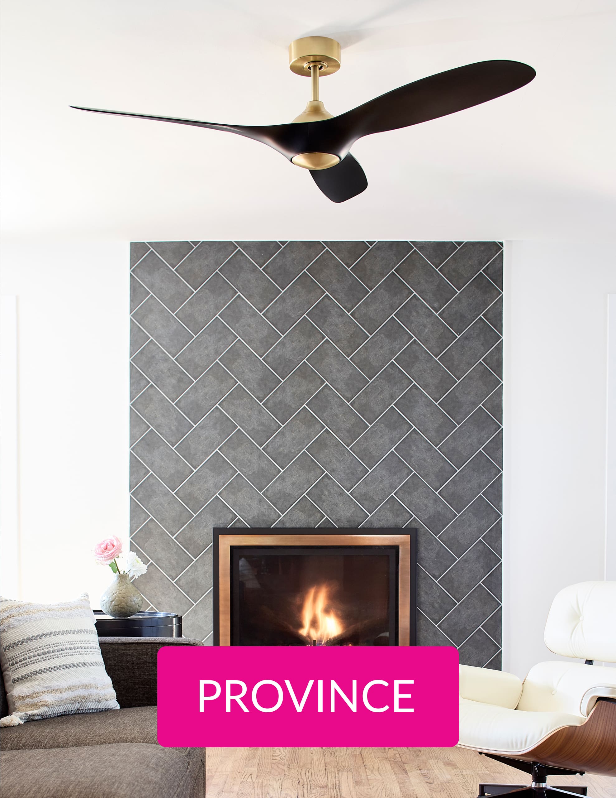 A fire place with a grey wall, a black fan and a pink button with the button Providence
